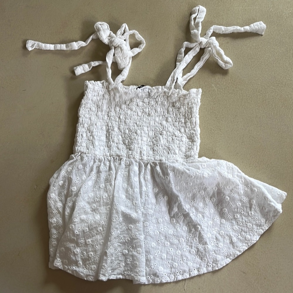 It is a white shirt with flowers. It is from Shein.